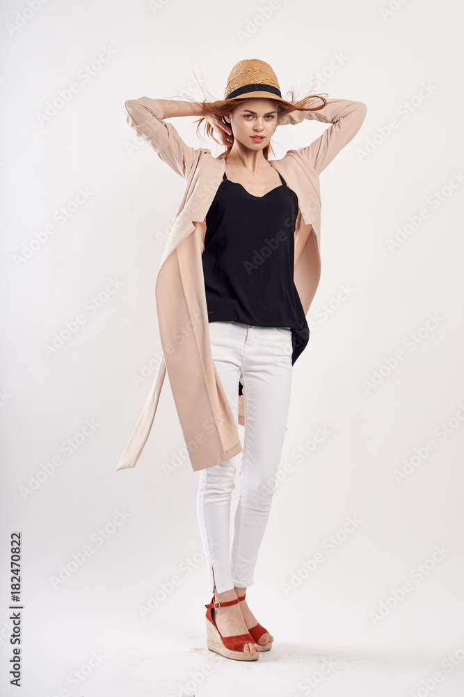 Young beautiful woman in a hat on a white background, style, fashion, beauty Young beautiful woman in a hat on a white background, style, fashion, beauty