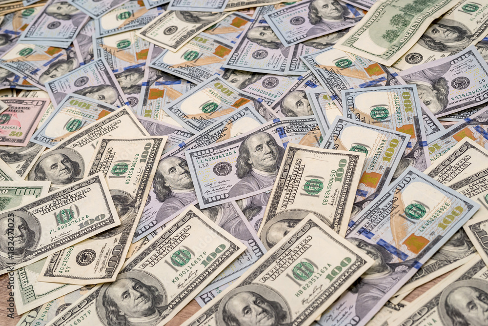 Background of 100 new and old dollar bills