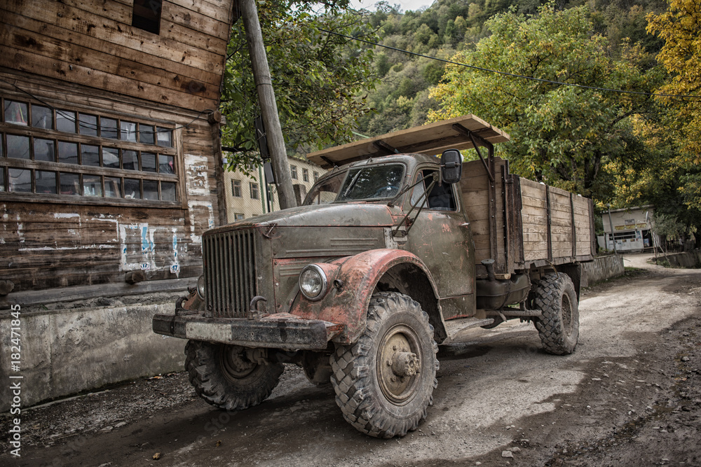 Vintage russian car truck in the mountains village