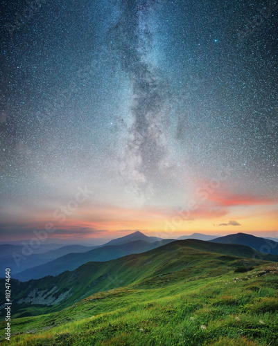 Mountain range and night sky. Natural summer landscape.