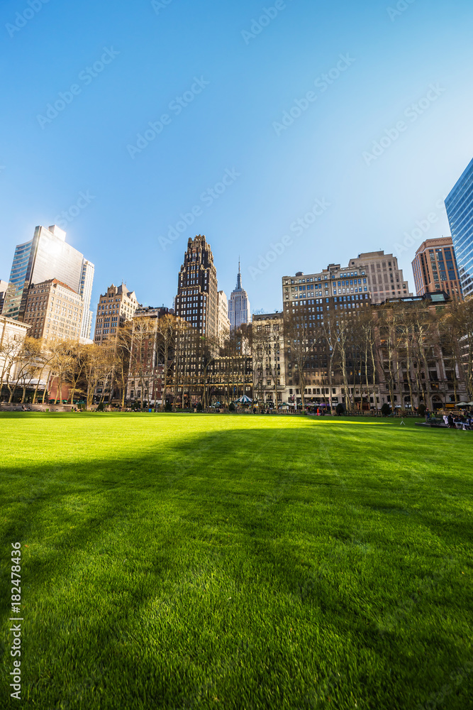 Green Lawn and Skyline with Skyscrapers viewed Bryant Park NYC