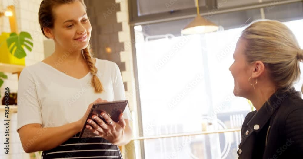 Woman placing order to waiters 