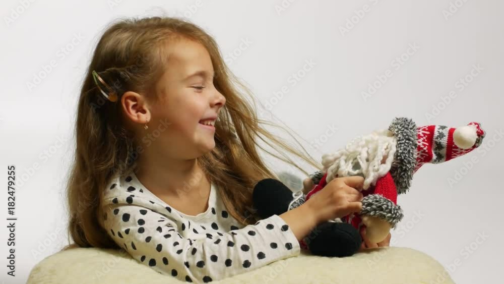 Beautiful smiling girl with Santa toy having fun. Beautiful smiling girl with Santa toy having fun.