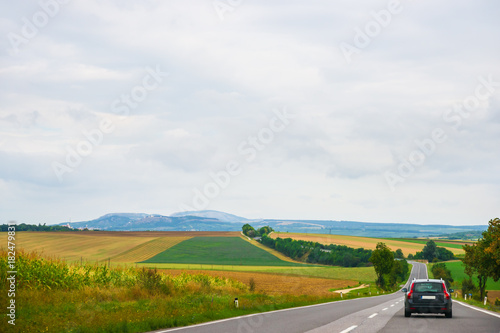 Landscape and car on road in South Moravia