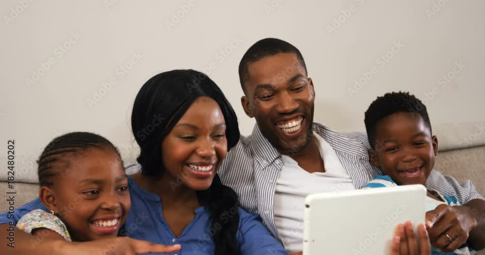 Family using digital tablet in living room Family using digital tablet in living room