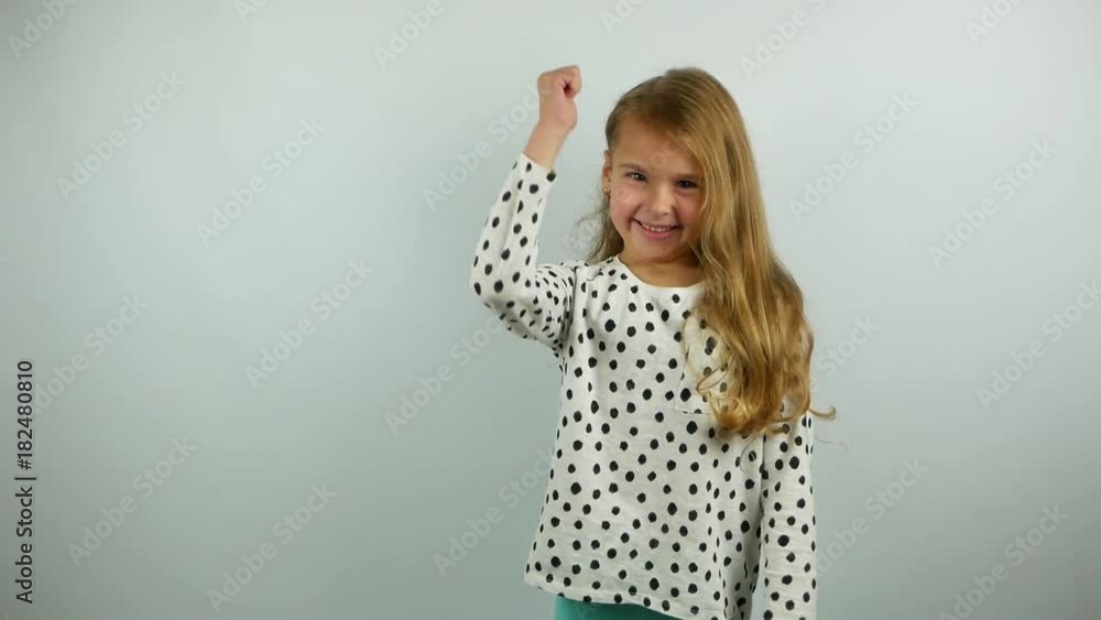 Beautiful blonde little girl smiling and gesturing. Slow motion of yes gesture by cute child. Beautiful blonde little girl smiling and gesturing. Slow motion of yes gesture by cute child.