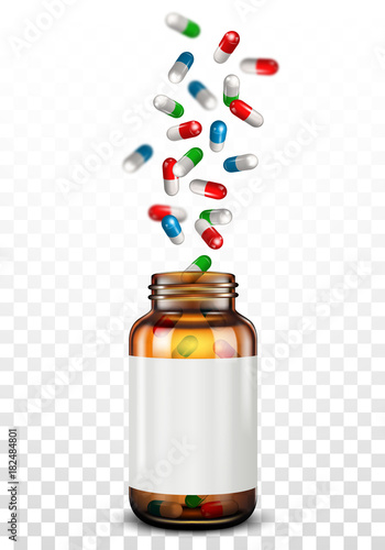 Medical pills falling into glass jar