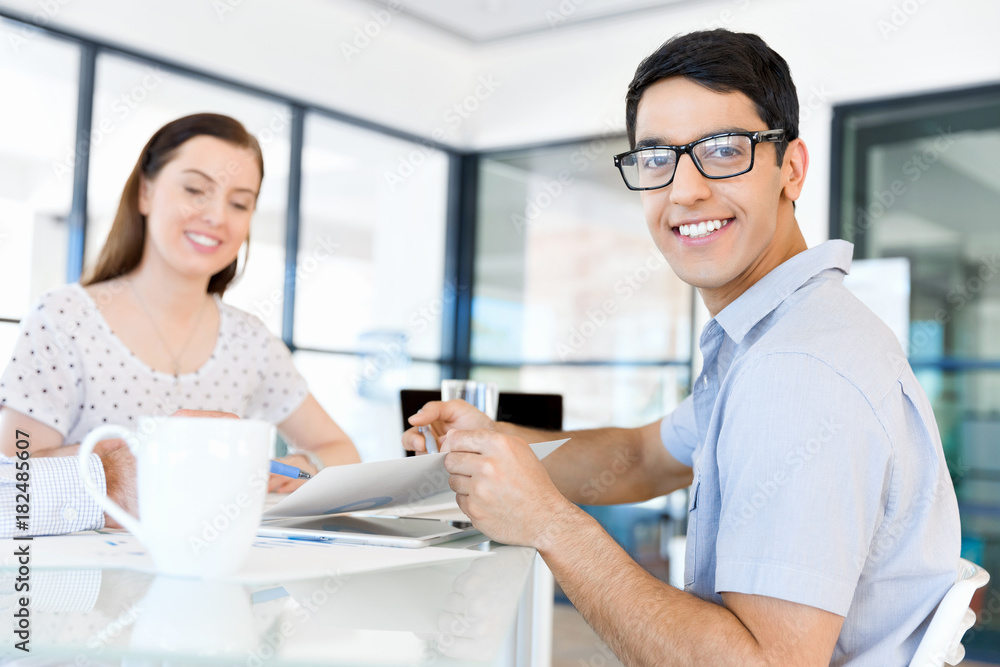 Image of two young business people in office Image of two young business people in office