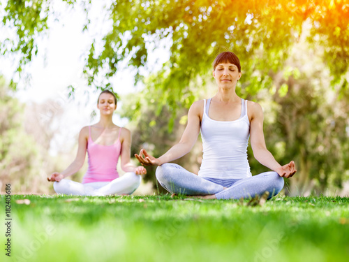 Young women exercising in the park