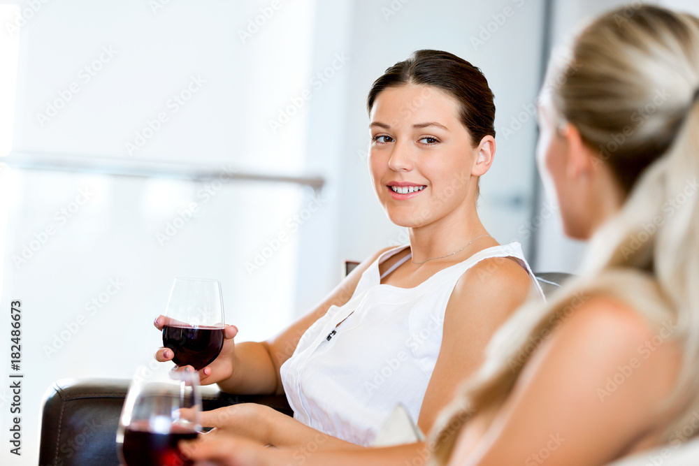 Female friends with glass of wine Female friends with glass of wine