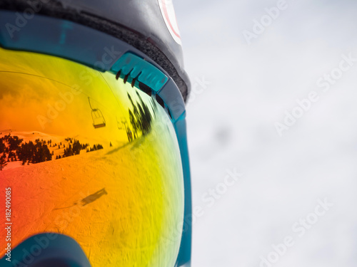 Reflection of a ski lifts in googles