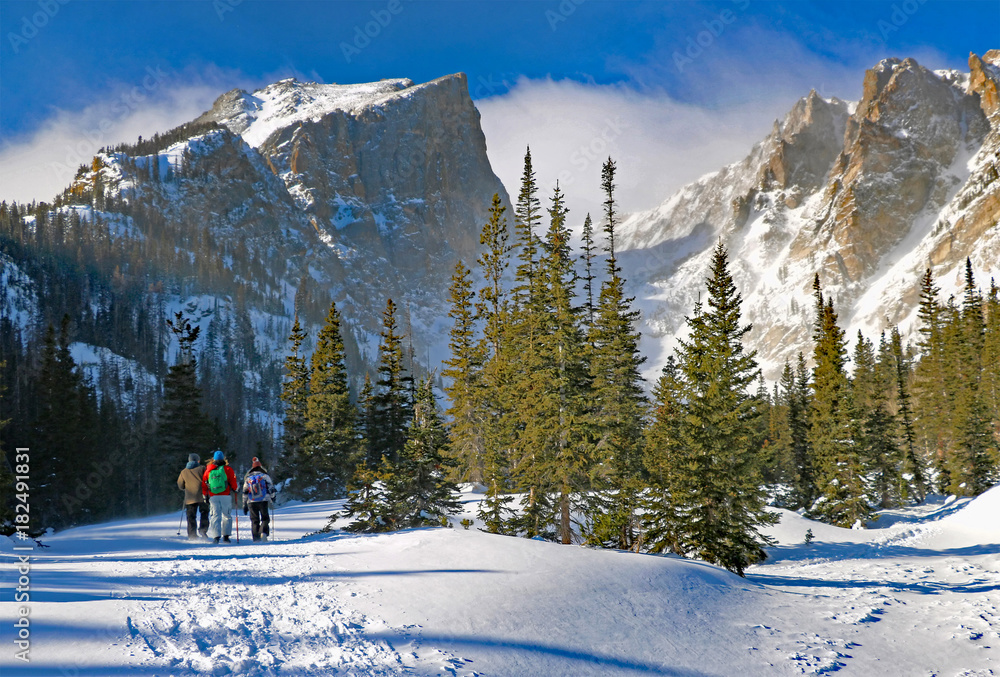 Winter hikers head toward Dream Lake in Colorados Rocky Mountain National Park