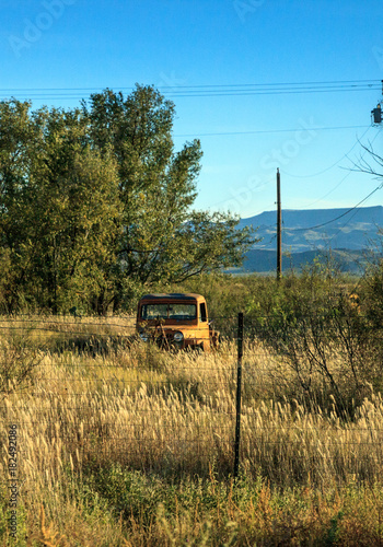 Rusted out classic Jeep truck on a Rustic Texas farm photo