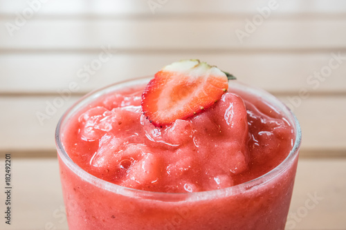 Wallpaper Mural Close up strawberry smoothie with fresh strawberry on wooden table Torontodigital.ca