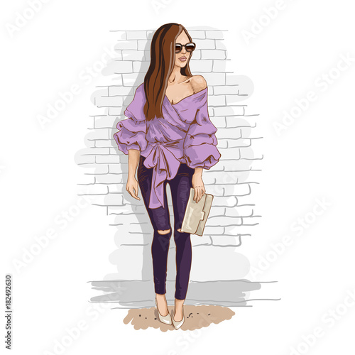 Fashion look. Urban casual outfit. Shirt with print and jeans. Young stylish woman with a bag in sunglasses. Hand drawn sketch. Vector illustration.
