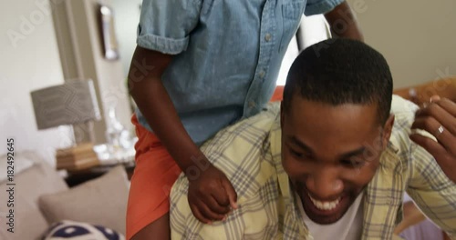 Father giving a piggyback ride to his son 