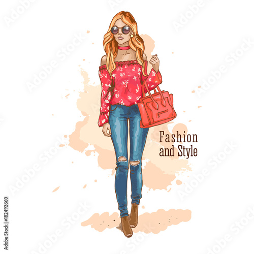 Fashion look. Urban casual outfit. Shirt with print and jeans. Young stylish woman with a bag in sunglasses. Hand drawn sketch. Vector illustration.