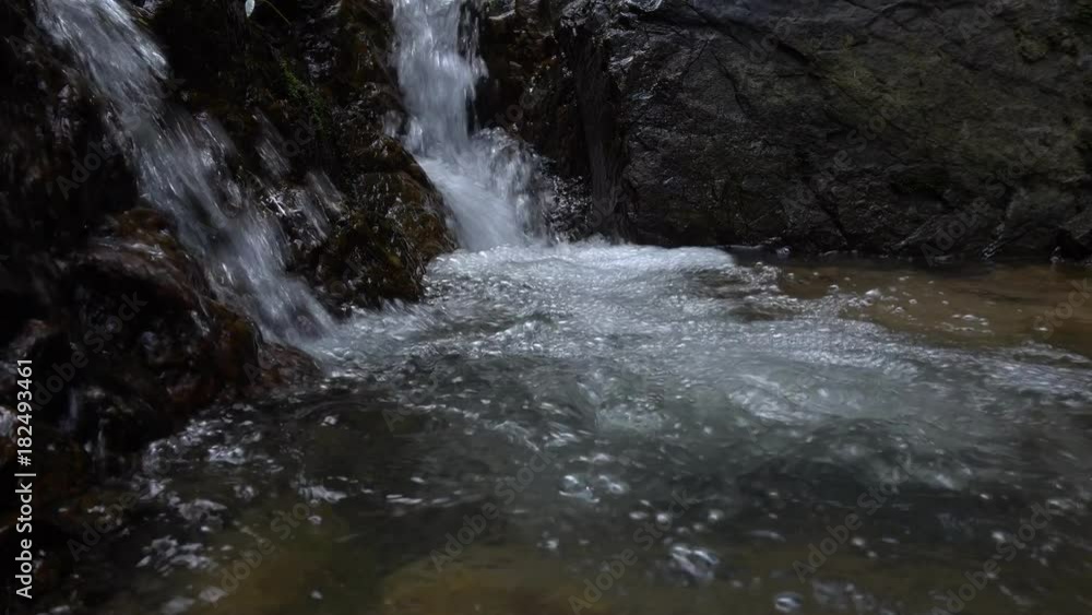 Pure fresh water small waterfall in rainforest Pure fresh water small waterfall in rainforest