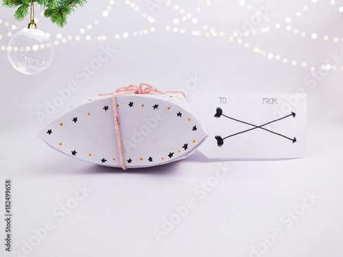 Christmas Decoration with White Square Round Christmas Gift Box with Christmas Ball and golden bokeh for holidays best background image for Holiday invitation and banners