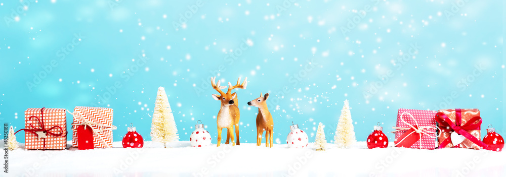 Christmas holiday theme with reindeer and Christmas gifts Christmas holiday theme with reindeer and Christmas gifts