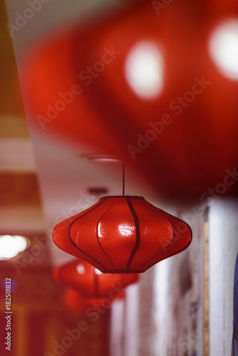 Ceiling paper chandeliers of red color in Chinese style. selective focus photo