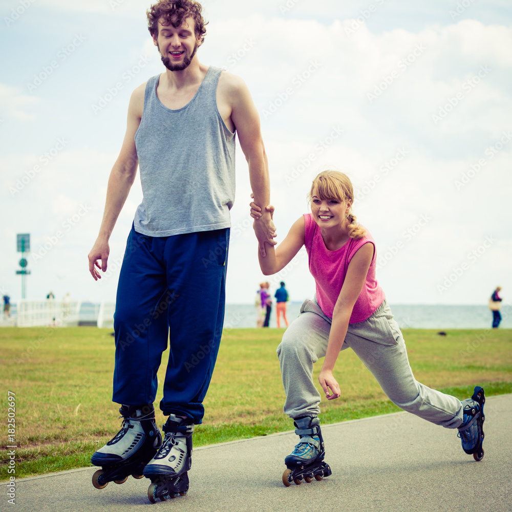 roller skater couple skating outdoor roller skater couple skating outdoor