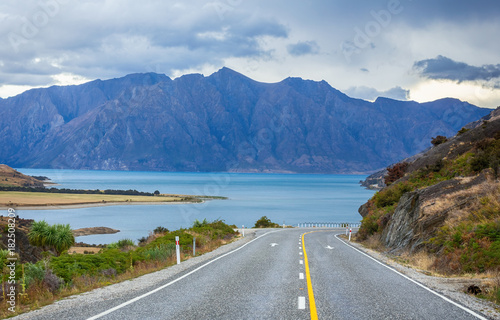 Highway Road Freeway stretching to Lake Hawea in lake Wanaka in New Zealand