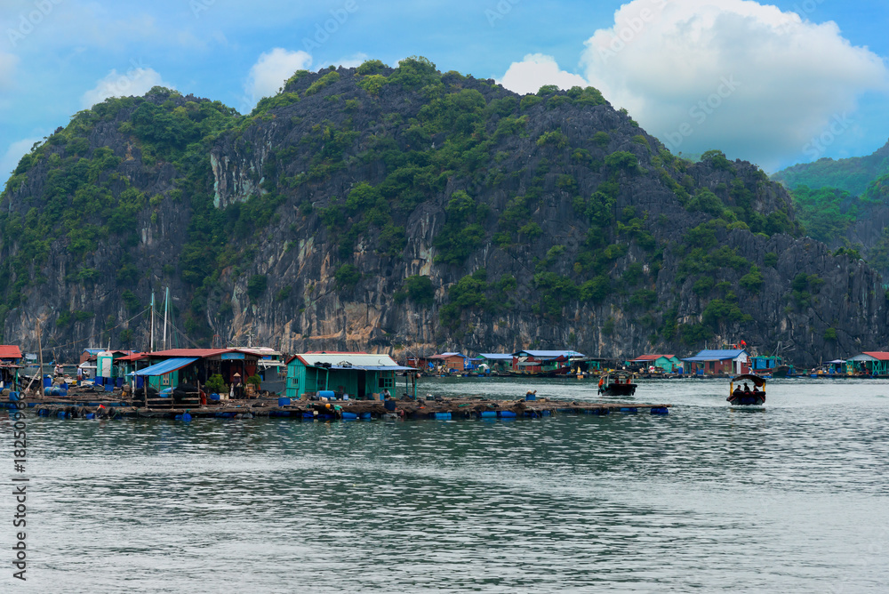 Floating fishing village and rock island in Lan Ha Bay travel destination beautiful sea and the beach in Vietnam, Southeast Asia. UNESCO World Heritage Site. Near Ha Long bay