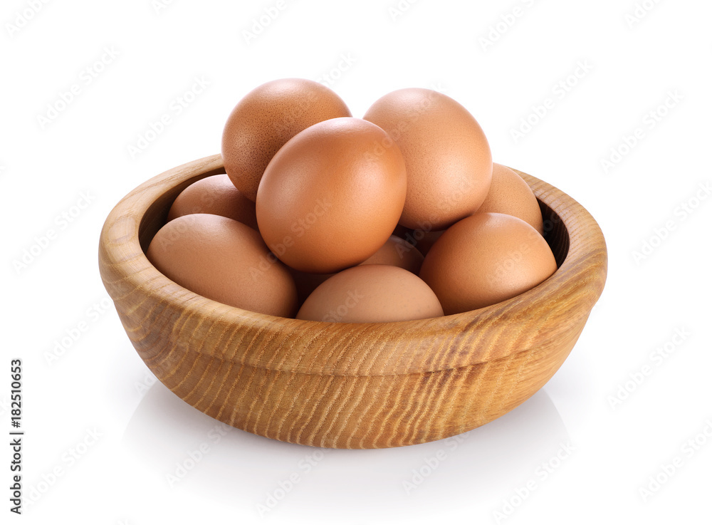 Wooden bowl with eggs isolated on white background. Wooden bowl with eggs isolated on white background.