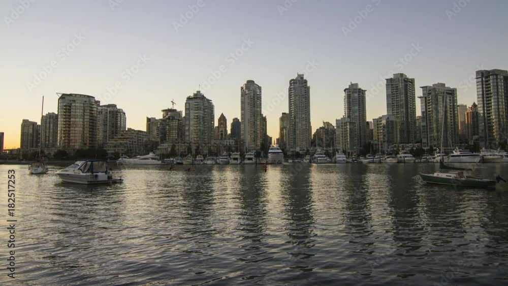 Time Lapse of Downtown Vancouver by the Sea Wall. Panning to the Granville Bridge after Sunset. Footage shot in Vancouver, BC, Canada Time Lapse of Downtown Vancouver by the Sea Wall. Panning to the Granville Bridge after Sunset. Footage shot in Vancouver, BC, Canada