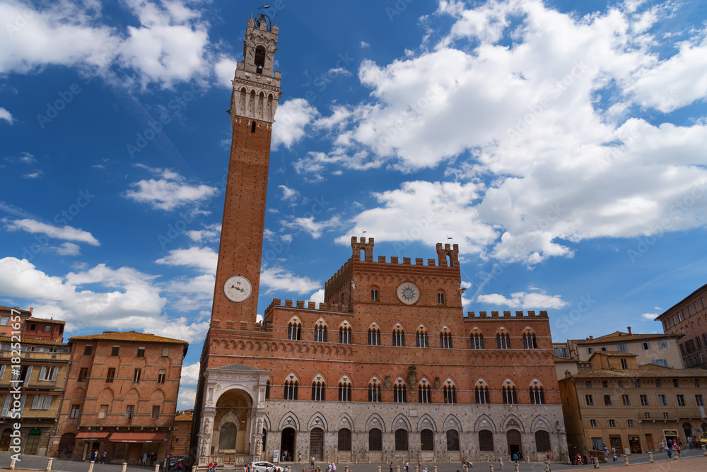 Campo Square (Piazza del Campo), Palazzo Pubblico and Mangia Tower (Torre del Mangia), Siena, Italy. The historic centre of Siena has been declared by UNESCO a World Heritage Site.