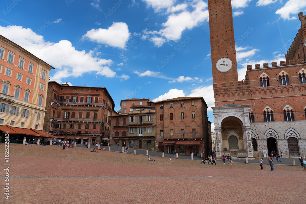 Campo Square (Piazza del Campo), Palazzo Pubblico and Mangia Tower (Torre del Mangia), Siena, Italy. The historic centre of Siena has been declared by UNESCO a World Heritage Site.