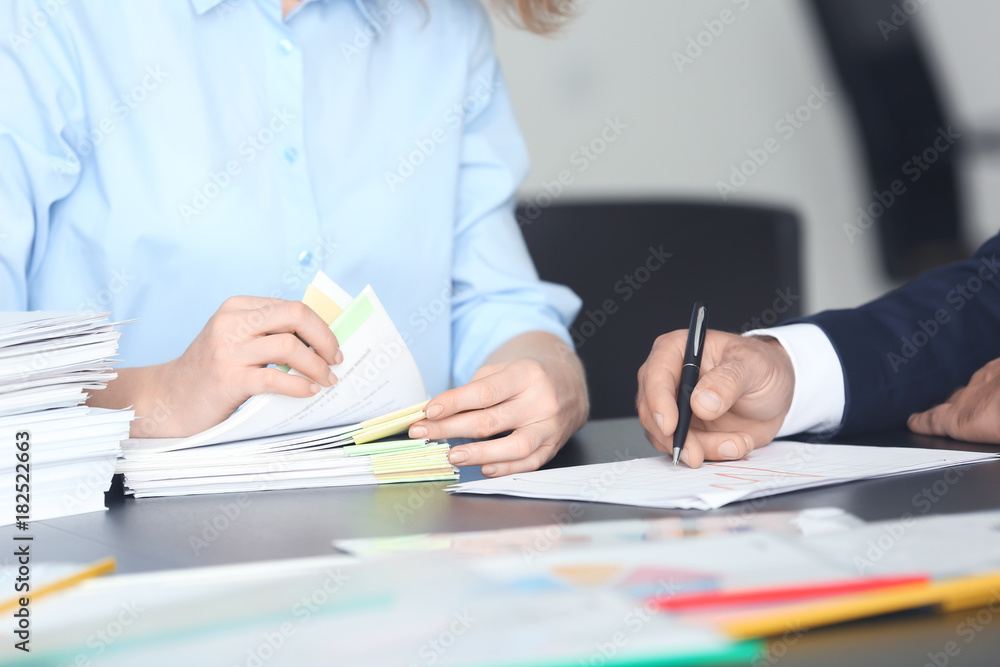People working with documents in office People working with documents in office