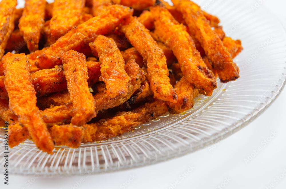 Homemade organic pumpkin. Traditional autumn dishes from pumpkin. Fried baked on grill pumpkin with spices and olive oil..