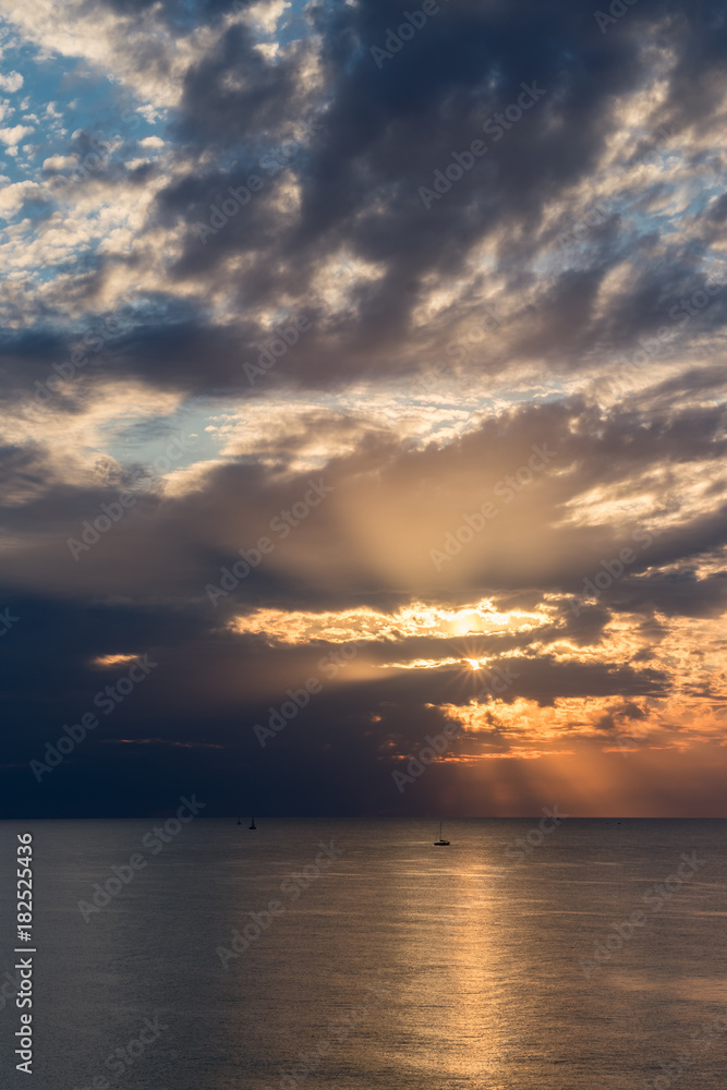 sun rays and reflections over the sea (sunset light)