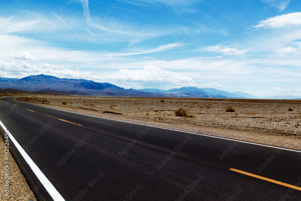 highway in the desert, mountains and beautiful sky