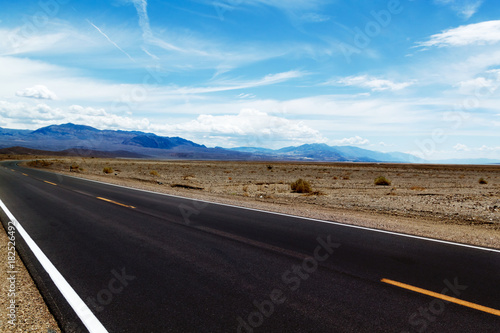 highway in the desert, mountains and beautiful sky