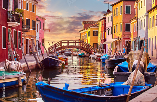 Burano island in Venice Italy picturesque sunset over canal © Yasonya