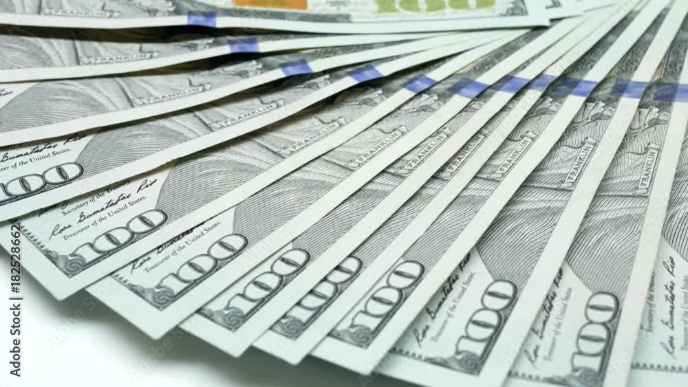 Many Hundred dollar bills cash rotate spinning. Close-up Many Hundred dollar bills cash rotate spinning. Close-up