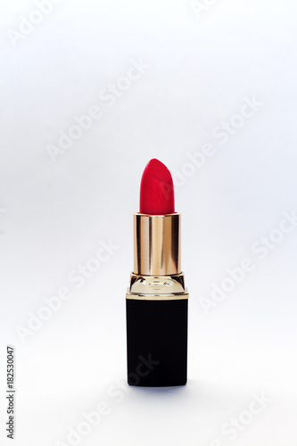 red lipstick on white background . photo