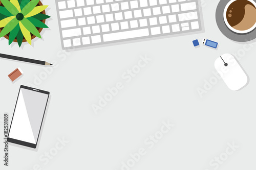 Top view of table working and working desk with gadget and free space for text with accessory on the table, laptop, notebook, desktop, phone, flash drive, coffee cup, letter, flowerpot, note, camera, 