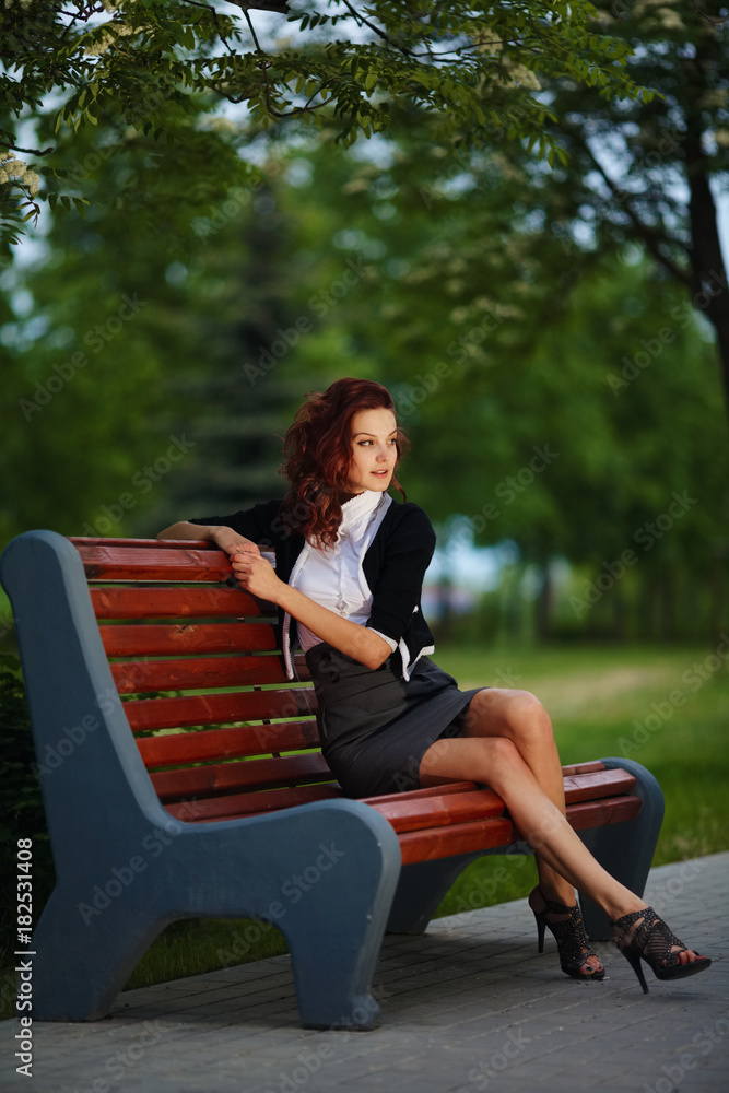 beautiful girl sitting on bench in park beautiful girl sitting on bench in park