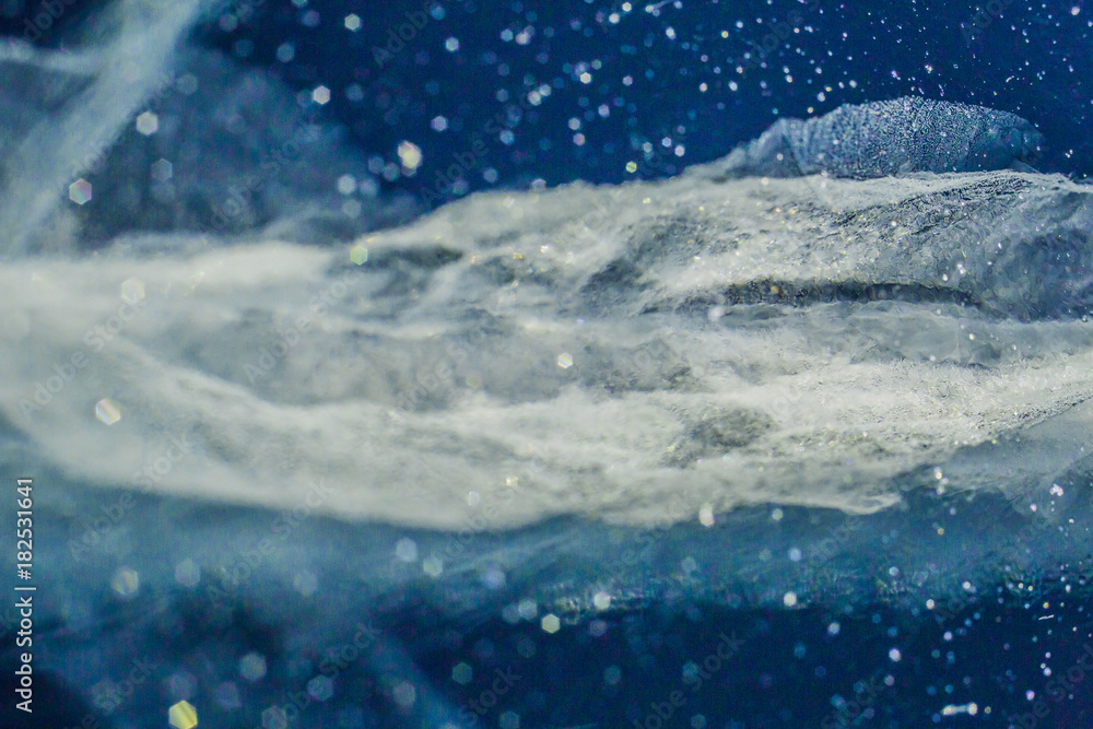 Fototapeta premium Cracks in ice. Winter in Siberia, Baikal Lake.