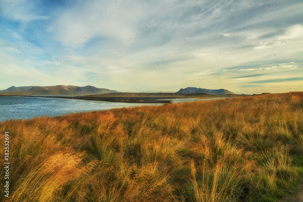 View of the bay  Atlantic Coast and mountains on the horizon. Beautiful landscape of Iceland.
