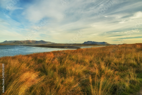 View of the bay  Atlantic Coast and mountains on the horizon. Beautiful landscape of Iceland.  