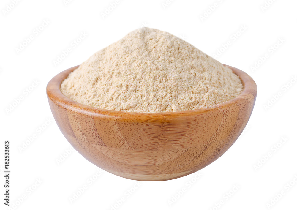 coconut flour in wooden bowl isolated on white coconut flour in wooden bowl isolated on white