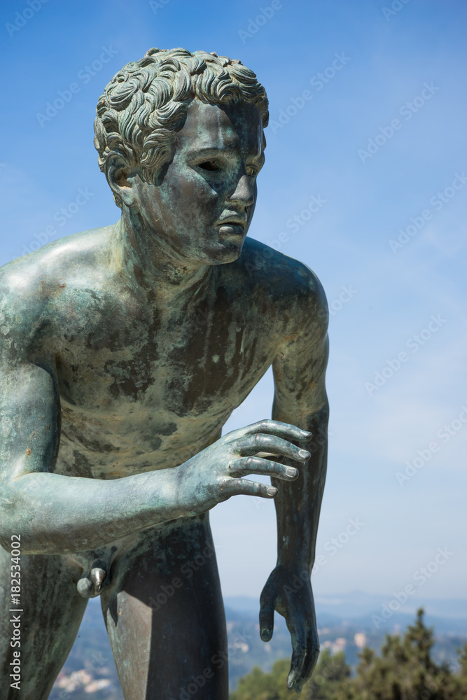 A statue of 'The Runner' in the garden of Achilleion in Corfu palace