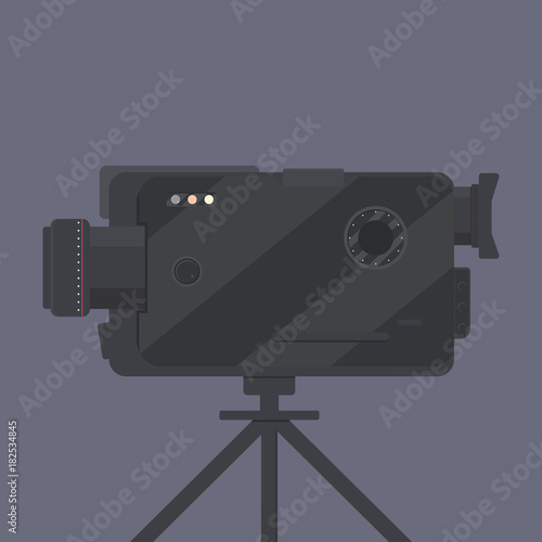 Standing black video camera in flat design