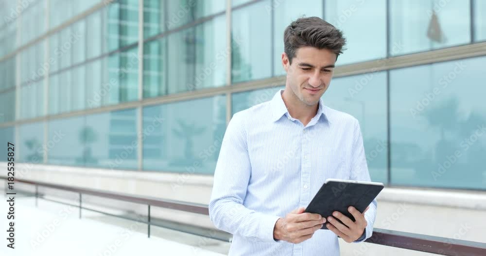 Caucasian businessman use of tablet computer Caucasian businessman use of tablet computer