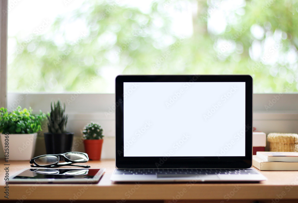 Mock up Laptop computer blank screen laptop on the desk at home office Mock up Laptop computer blank screen laptop on the desk at home office